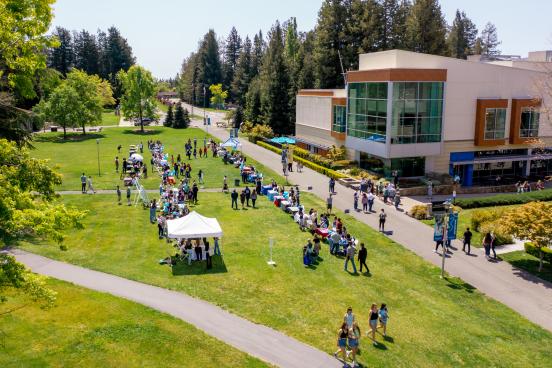 Aeria of people tabling on a large lawn area