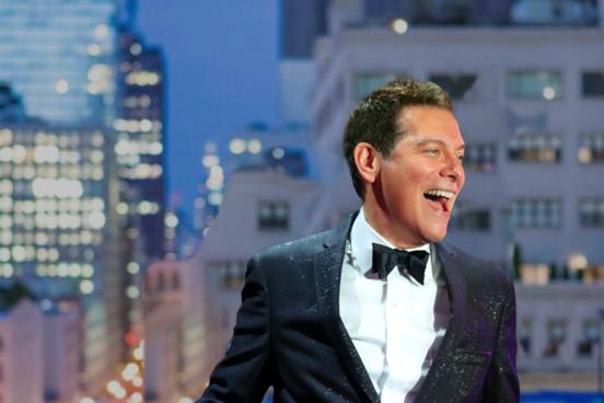 Michael Feinstein smiling in a suit