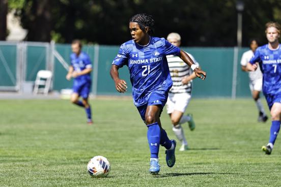 Men's soccer play kicking soccer ball