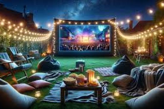 Movie on a screen with blankets on the lawn