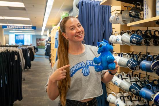 Student buying sonoma state apparel and swag at the university store
