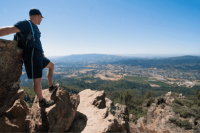 Person on a hike looking down on Sonoma County view from a far