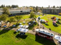 Aerial of event Palooza showing food trucks and tents on a green lawn