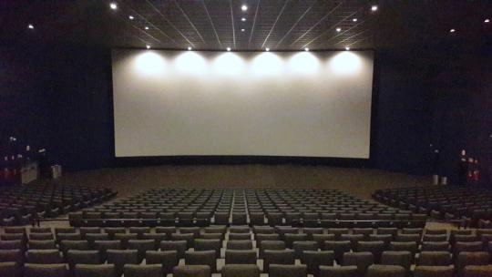 Movie theater with screen and chairs