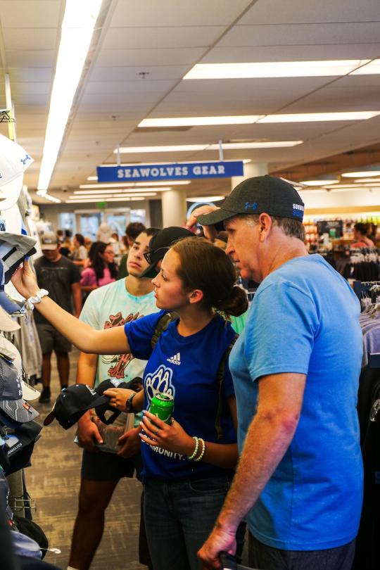 People looking at a pennant holding it up