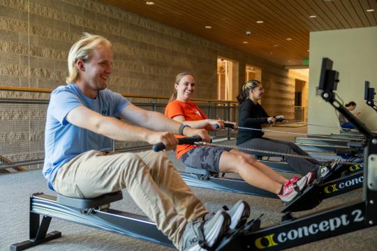 3 students working out at campus recreation