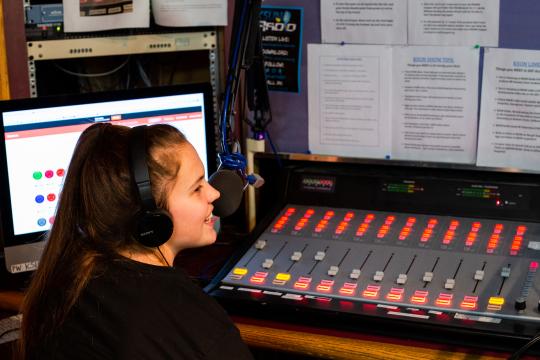 Student during radio show at KSUN