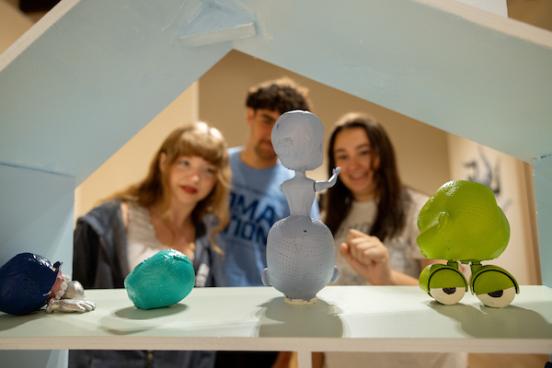 Three Students Looking at an Art Piece