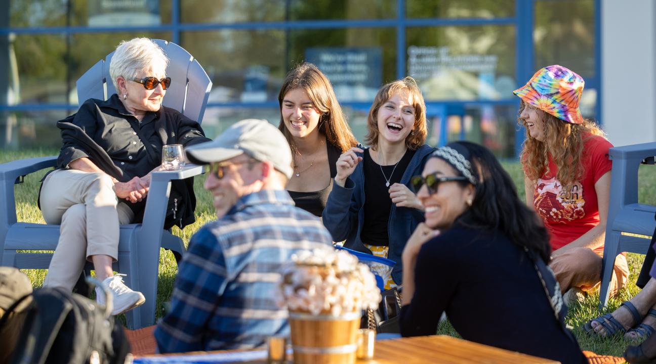 Group of people sitting and laughing