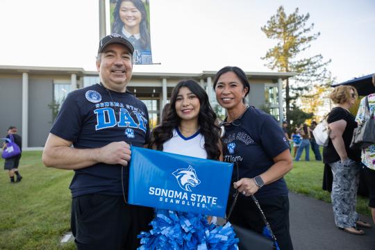 Family holding SSU sign