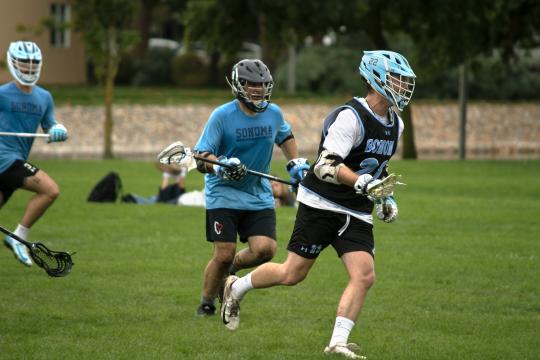 Sonoma State men’s club lacrosse players compete during the annual alumni game at Beaujolais Field.